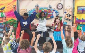 Professional actors from The National Theatre for Children portray characters teaching students about energy conservation.